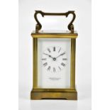 GARRARD & CO LTD; a brass cased carriage clock, the white dial set with Roman numerals and inscribed