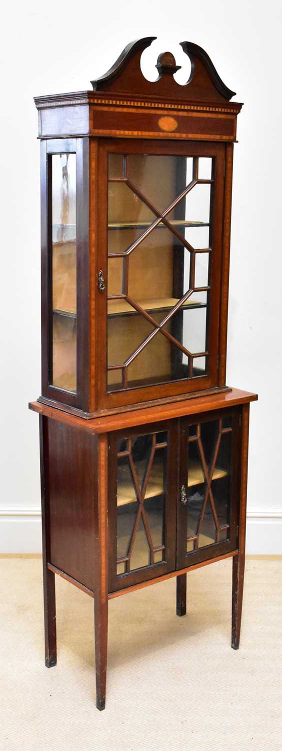 An Edwardian inlaid mahogany display cabinet, with astragal glazed doors on tapering legs, height