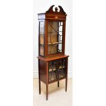 An Edwardian inlaid mahogany display cabinet, with astragal glazed doors on tapering legs, height