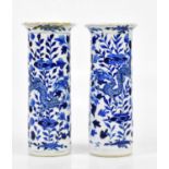 A pair of late 19th century Chinese blue and white porcelain sleeve vases, each decorated with