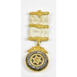 A Victorian yellow metal mounted Masonic jewel with diamond effect decoration, in Clowes & Woodward,