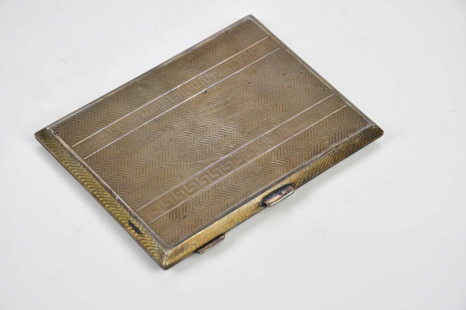 M H MAYER LTD; a George V hallmarked silver cigarette case of rectangular form with engine turned - Image 2 of 4