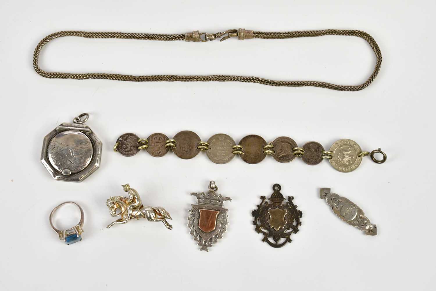 A small collection of silver jewellery to include ring, locket, bracelet, etc.