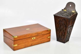 A 19th century carved oak candle box, height 40cm, and a Victorian mahogany brass bound writing