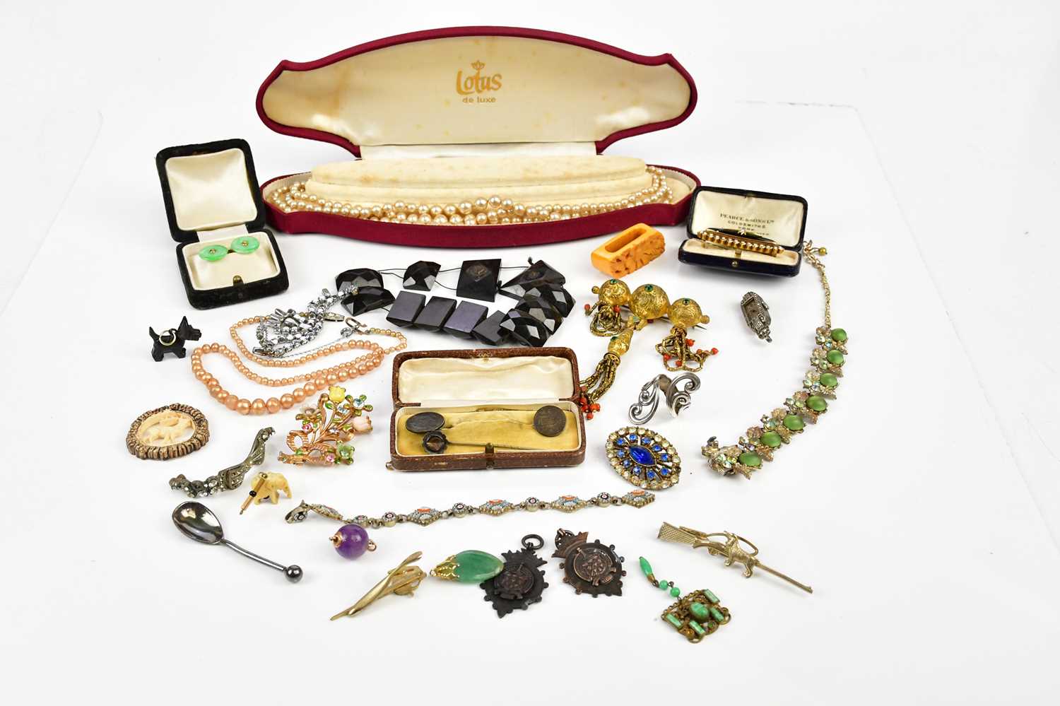 A small collection of costume jewellery to include a faux pearl necklace, bracelets, jade cufflinks,