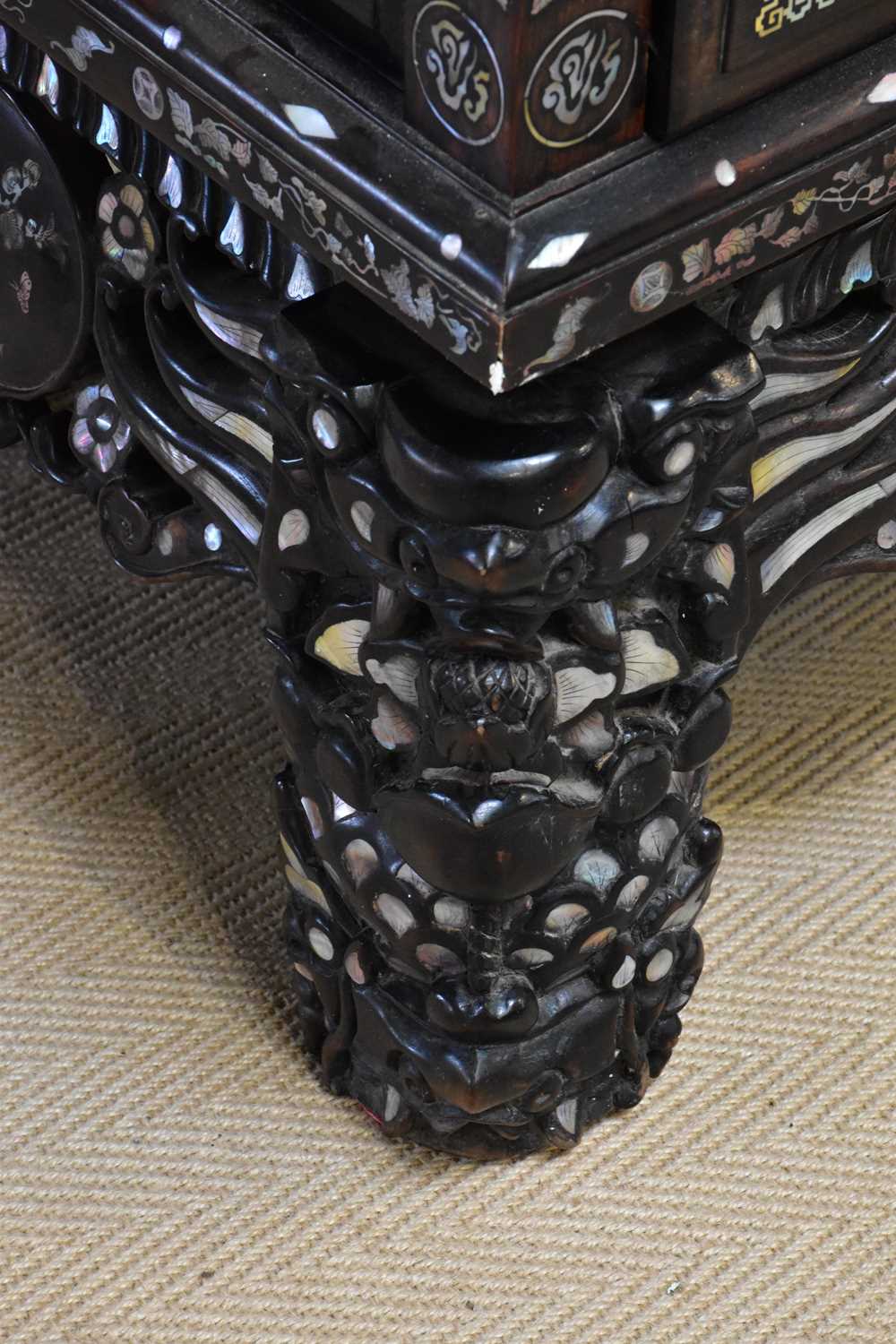 A Chinese ebonised carved display cabinet with mother of pearl inlaid decoration depicting - Image 8 of 13