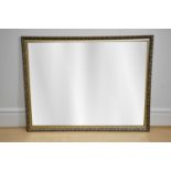 A modern gilt framed rectangular wall mirror with bevelled plate,134 x 102cm.
