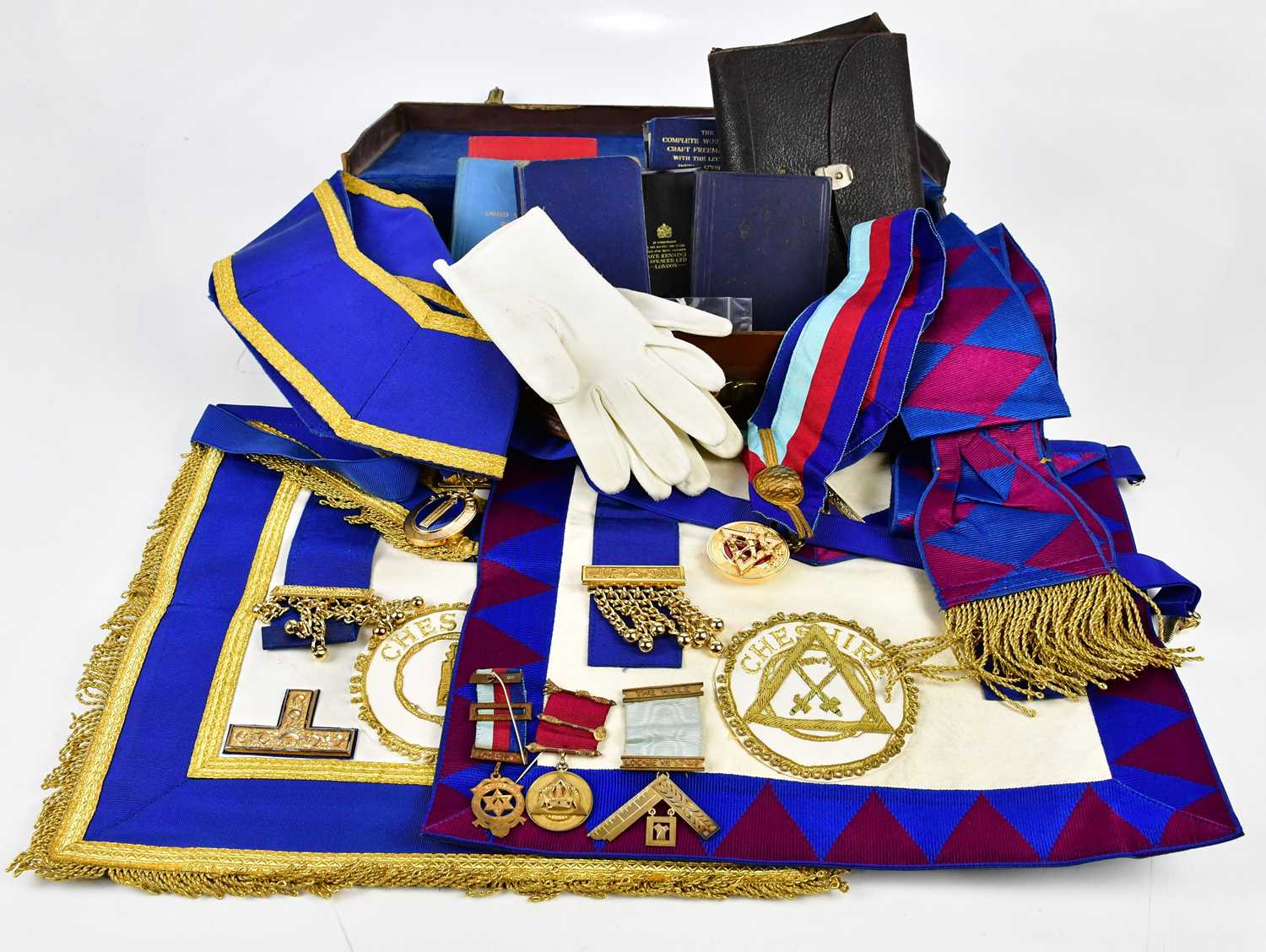 A collection of Masonic regalia including booklet, jewels including a hallmarked silver gilt example