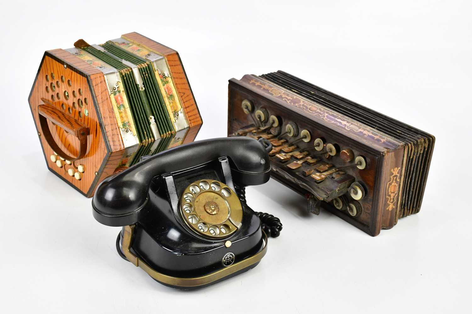 A Commander concertina, an inlaid rosewood squeezebox with mother of pearl keys and a vintage