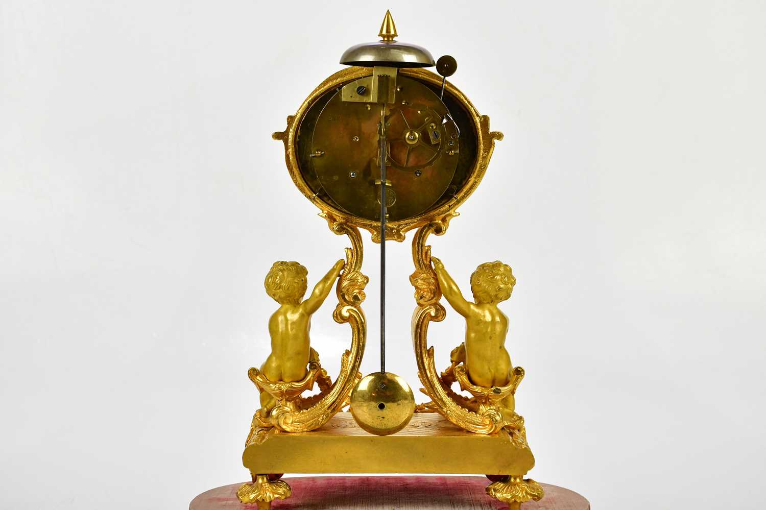 A late 19th century ormolu mantel clock, the oval dial set with Roman numerals on scrolling sabre - Image 5 of 5