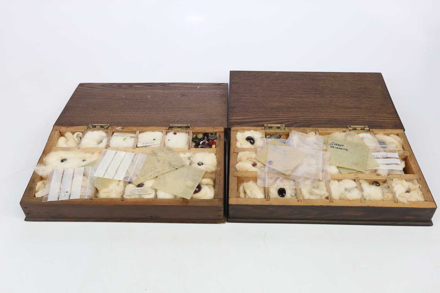 Two cases of gemological samples including peridot, quartz, aquamarine, tiger's eye, etc.