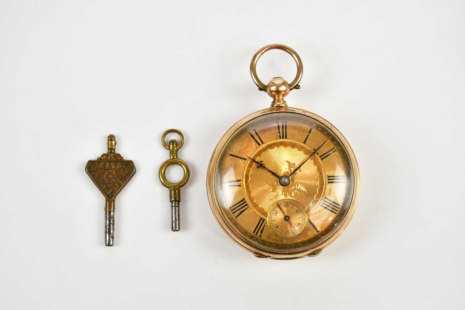 A yellow gold cased open face pocket watch with Roman numerals to the engraved dial, stamped 9K,