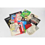 A collection of football ephemera including an autograph book bearing various autographs including