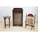 An Edwardian mahogany cabinet with raised back above a single drawer and astragal glazed door, width