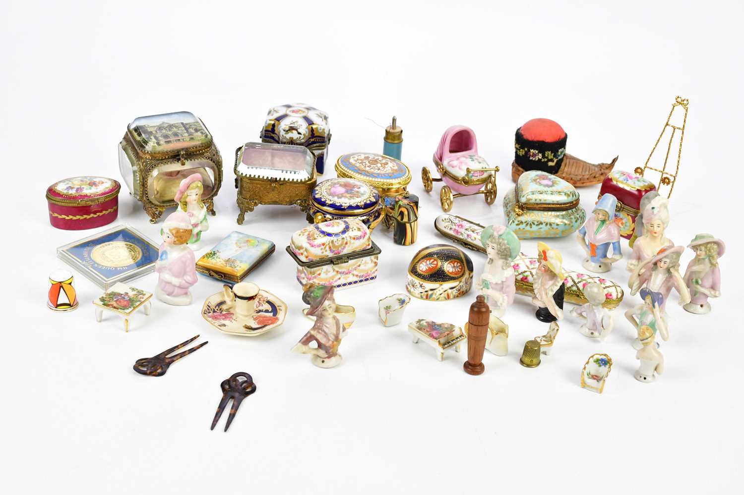 A collection of decorative ceramic pill boxes and ceramics including Royal Crown Derby animal form