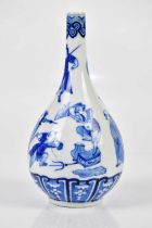 A late 19th century Chinese blue and white vase decorated with the immortals, with four character