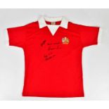 MANCHESTER UNITED; a 1970s replica signed football shirt, signed to the front by Best, Law and