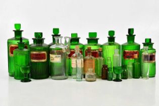 A collection of early 19th century and later apothecary bottles including an unusual free blown