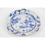 NANKING CARGO; an 18th century Chinese blue and white porcelain cabinet plate with scalloped edge