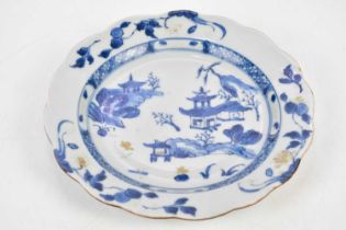 NANKING CARGO; an 18th century Chinese blue and white porcelain cabinet plate with scalloped edge