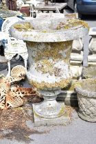 A Victorian stone garden urn on square stepped plinth, height 109cm. Condition Report: Urn looks