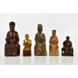 A group of five carved wooden painted Chinese figures, largest 29cm.