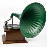 An early 20th century oak wind up gramophone with green painted metal horn and an oak hall mirror