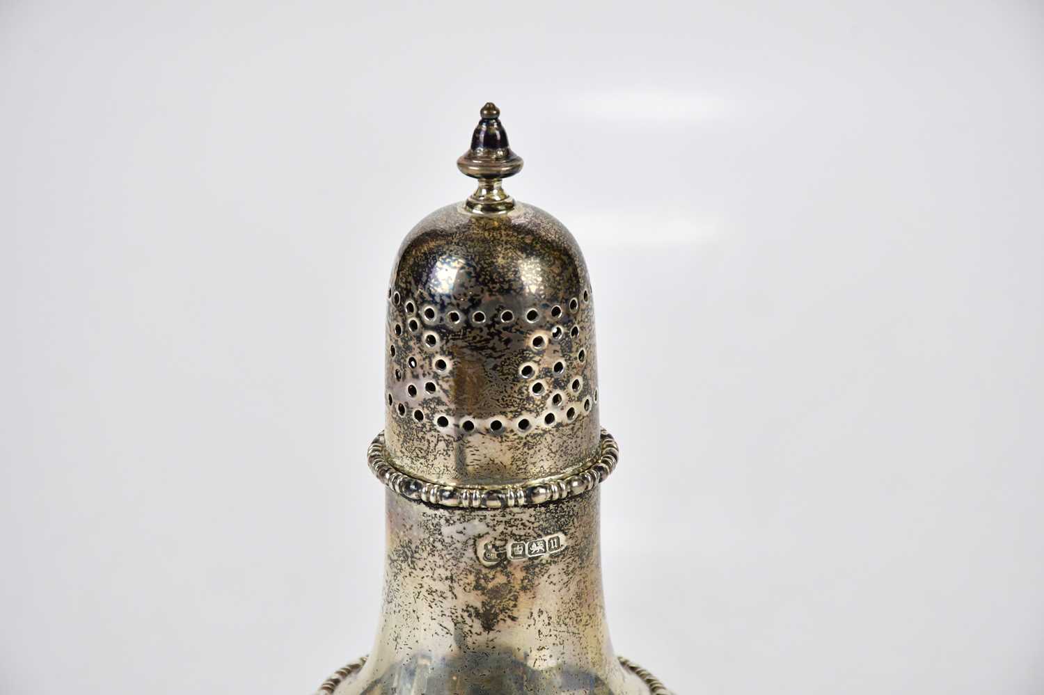 A George V hallmarked silver sugar caster with cast beaded rims, Sheffield 1912, approx 7ozt/218g. - Image 2 of 4