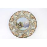THOUNE POTTERY; a hand painted wall plaque decorated with mountainous river scene, signed R Gilsien,