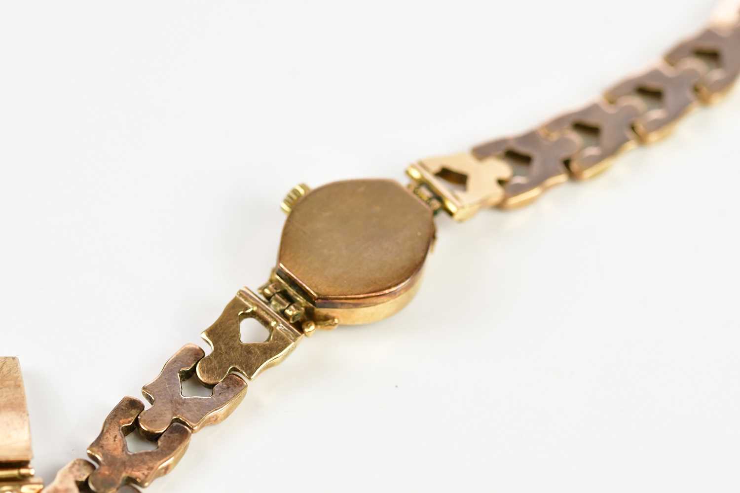 ENIGAR; a 9ct gold lady's wristwatch, set with batons, on 9ct gold textured strap, total weight - Image 3 of 5
