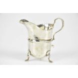 ROBERT PRINGLE & SONS; a George V hallmarked silver cream jug, Chester 1919, approx 2.36ozt/73.5g.