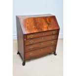 A late George III mahogany bureau, with fall front above four graduated long drawers, on splayed