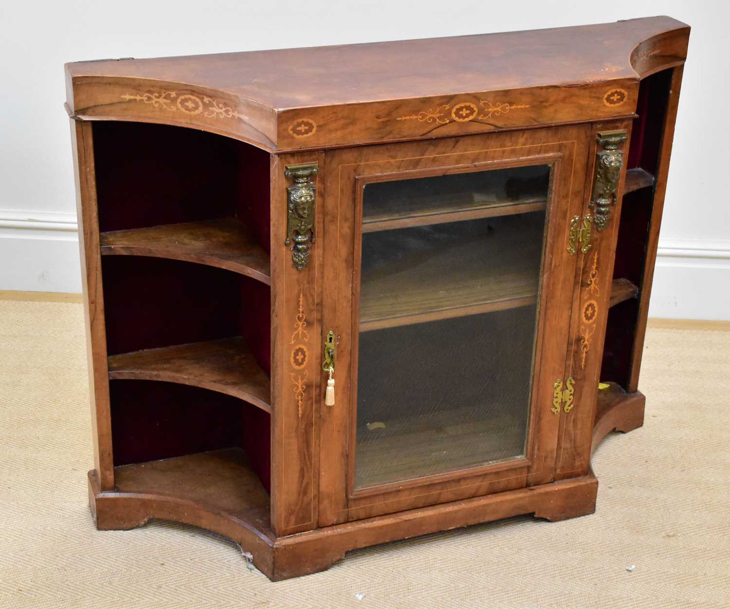 A late 19th century inlaid credenza with gilt metal applied mount flanking the single glazed door on