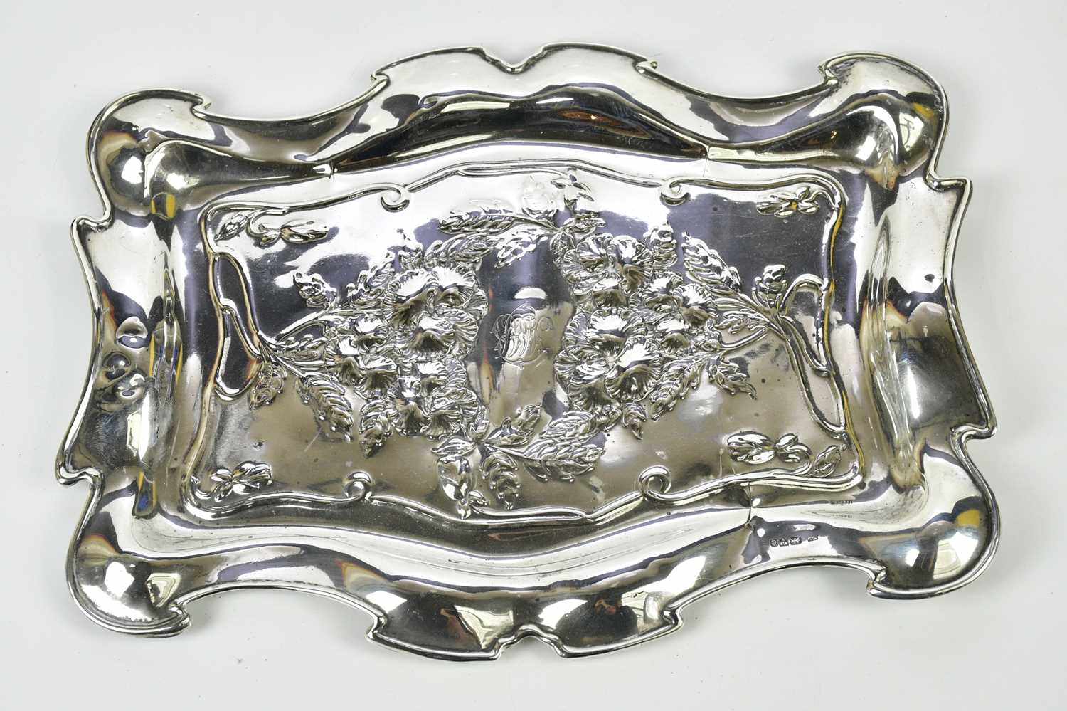 WILLIAM NEALE; an Edwardian hallmarked silver Art Nouveau tray, 9.5ozt / 306g, length 30cm.