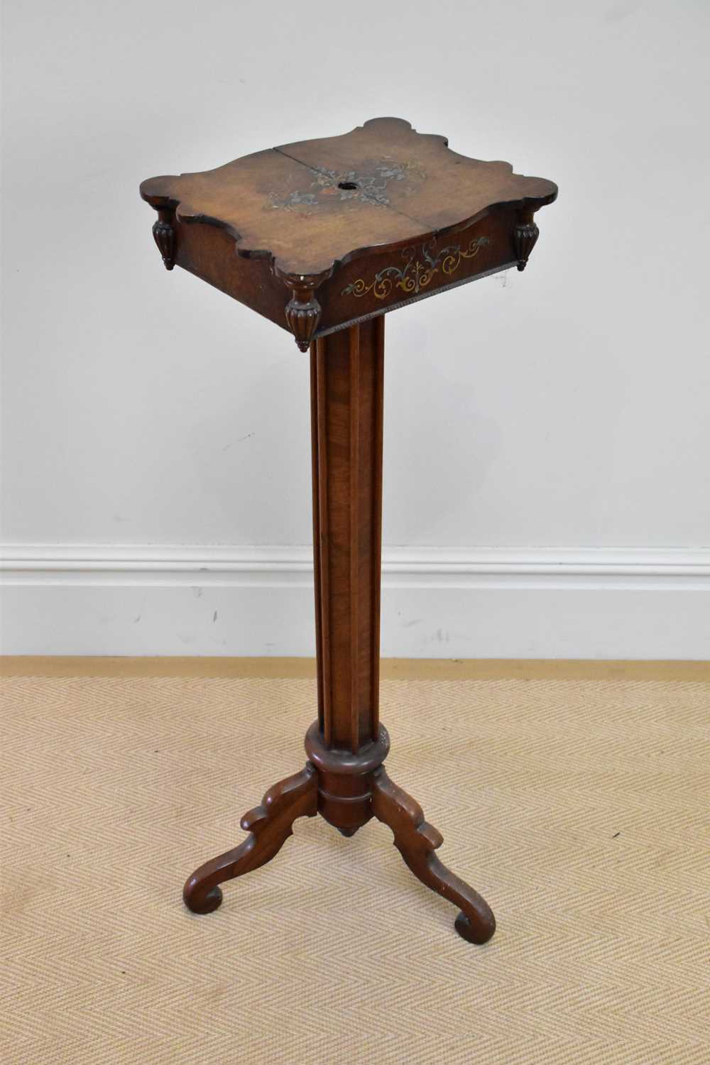 A late 19th century inlaid rosewood mirror/candle stand with pull-out slides enclosing fitted