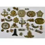 A small collection of assorted cap badges including the Cheshire Regiment, Royal Artillery, London