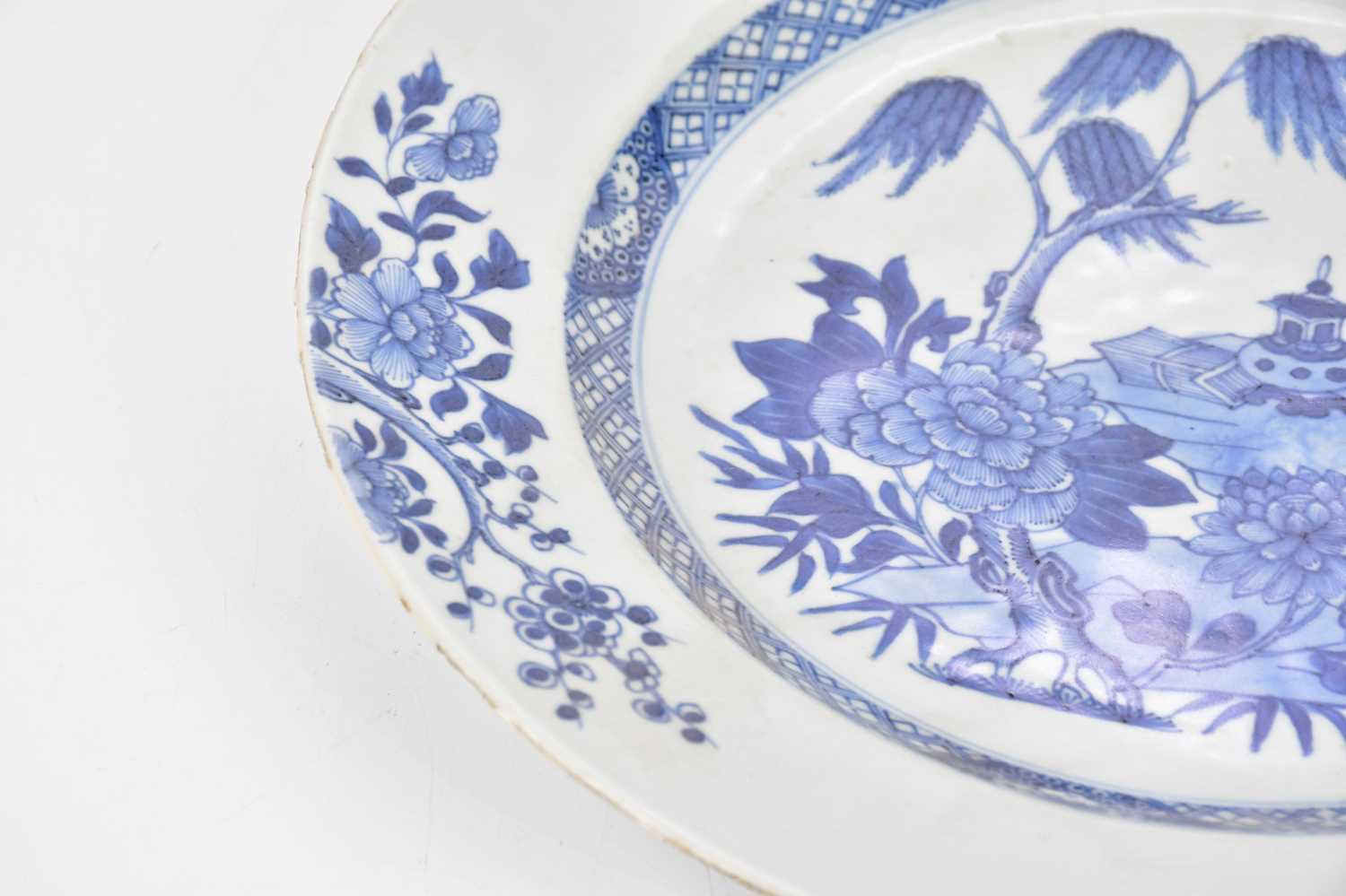 An 18th century Chinese Export blue and white plate, decorated with central scene of objects on a - Image 3 of 5
