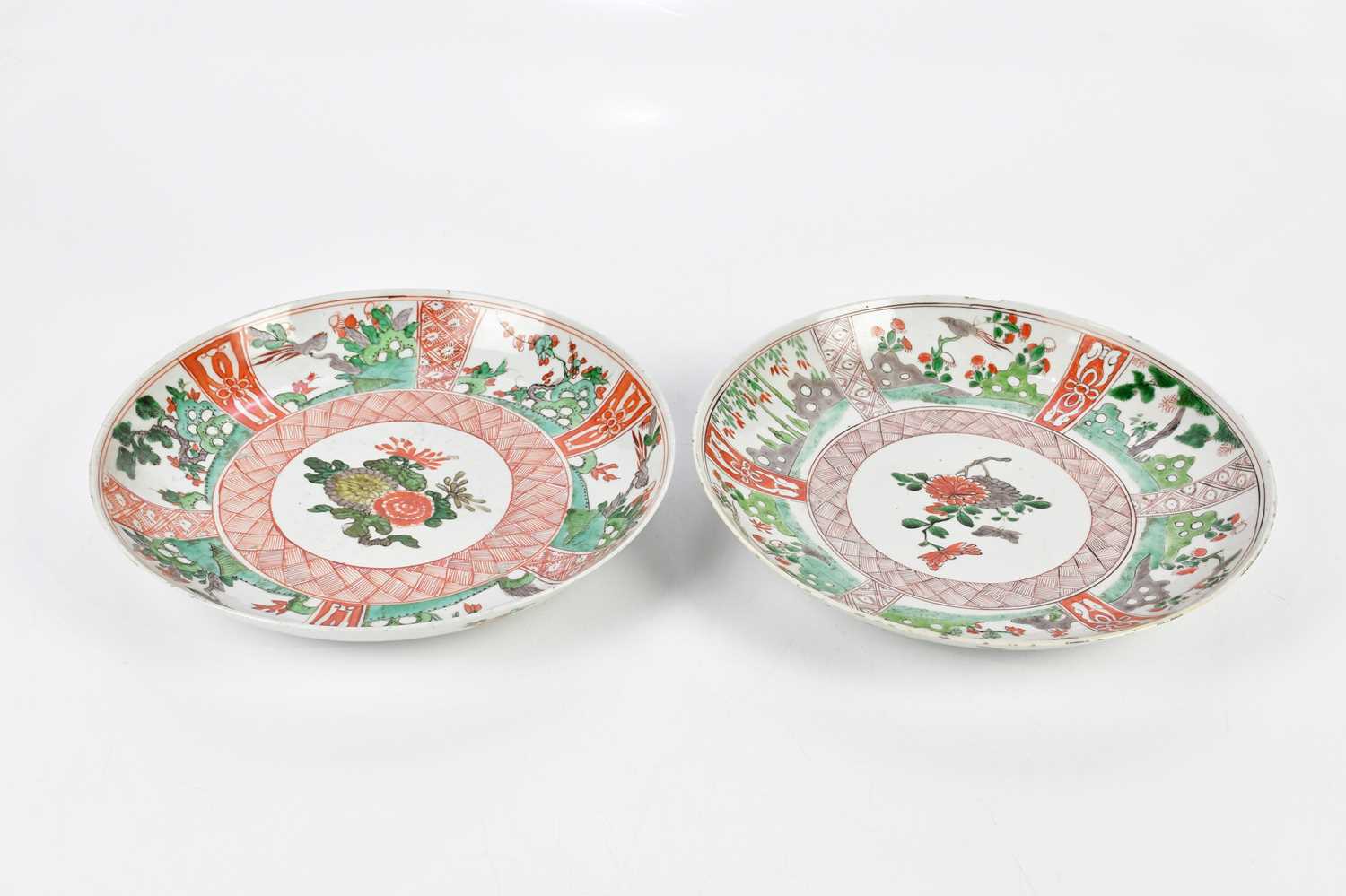 Two 19th century Chinese Famille Verte Wucai plates, each decorated with floral sprays within