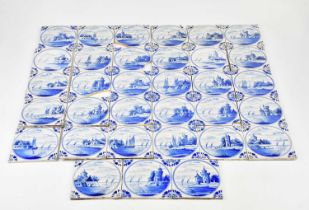 A collection of thirty-three Delft tiles, various scenes, predominantly landscapes, approx 13 x