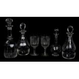 Three cut glass decanters, height of largest 27cm, together with further etched glass decanter and