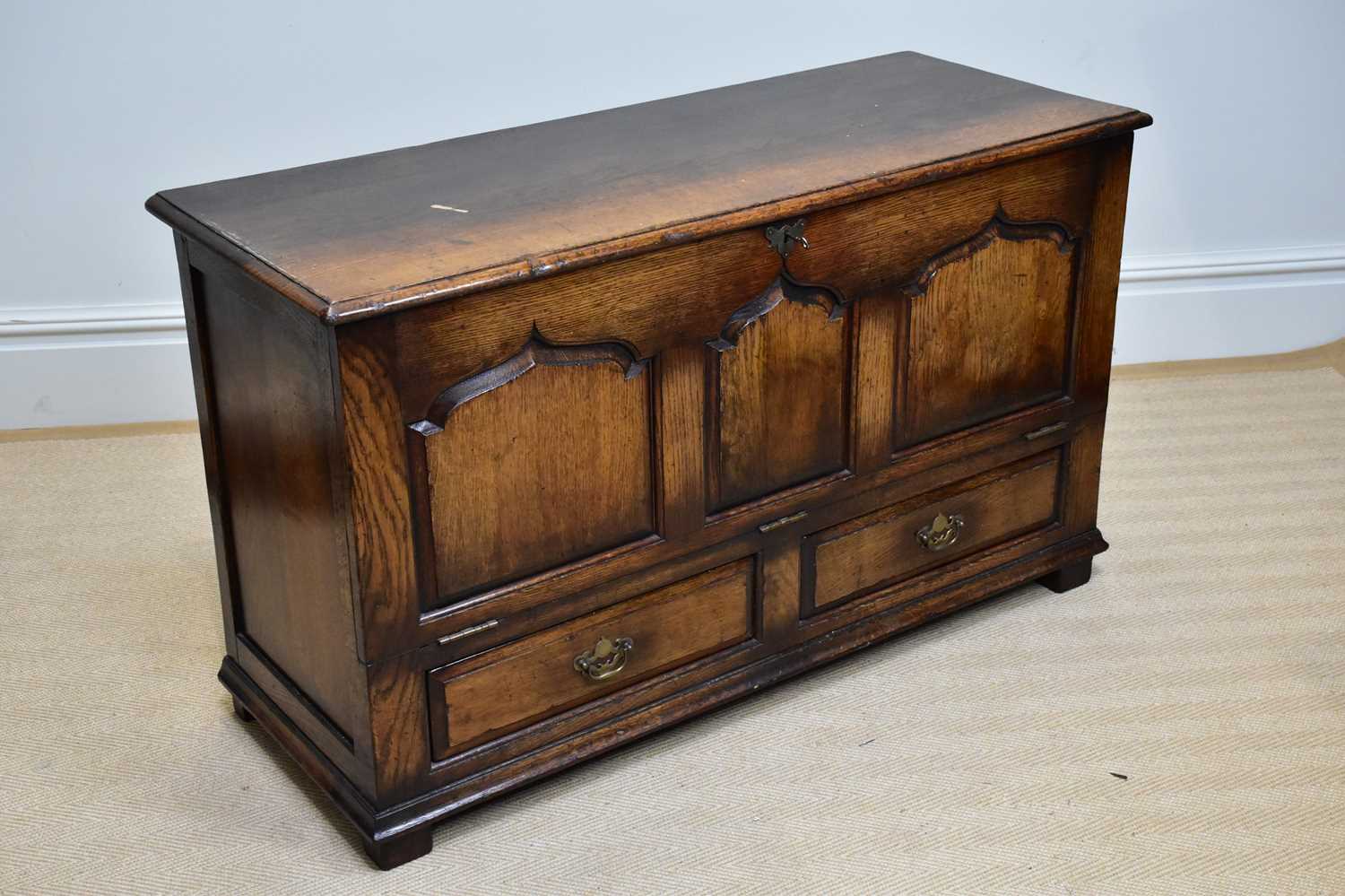 TITCHMARSH & GOODWIN; a reproduction oak coffer with panelled fall front and two base drawers, width