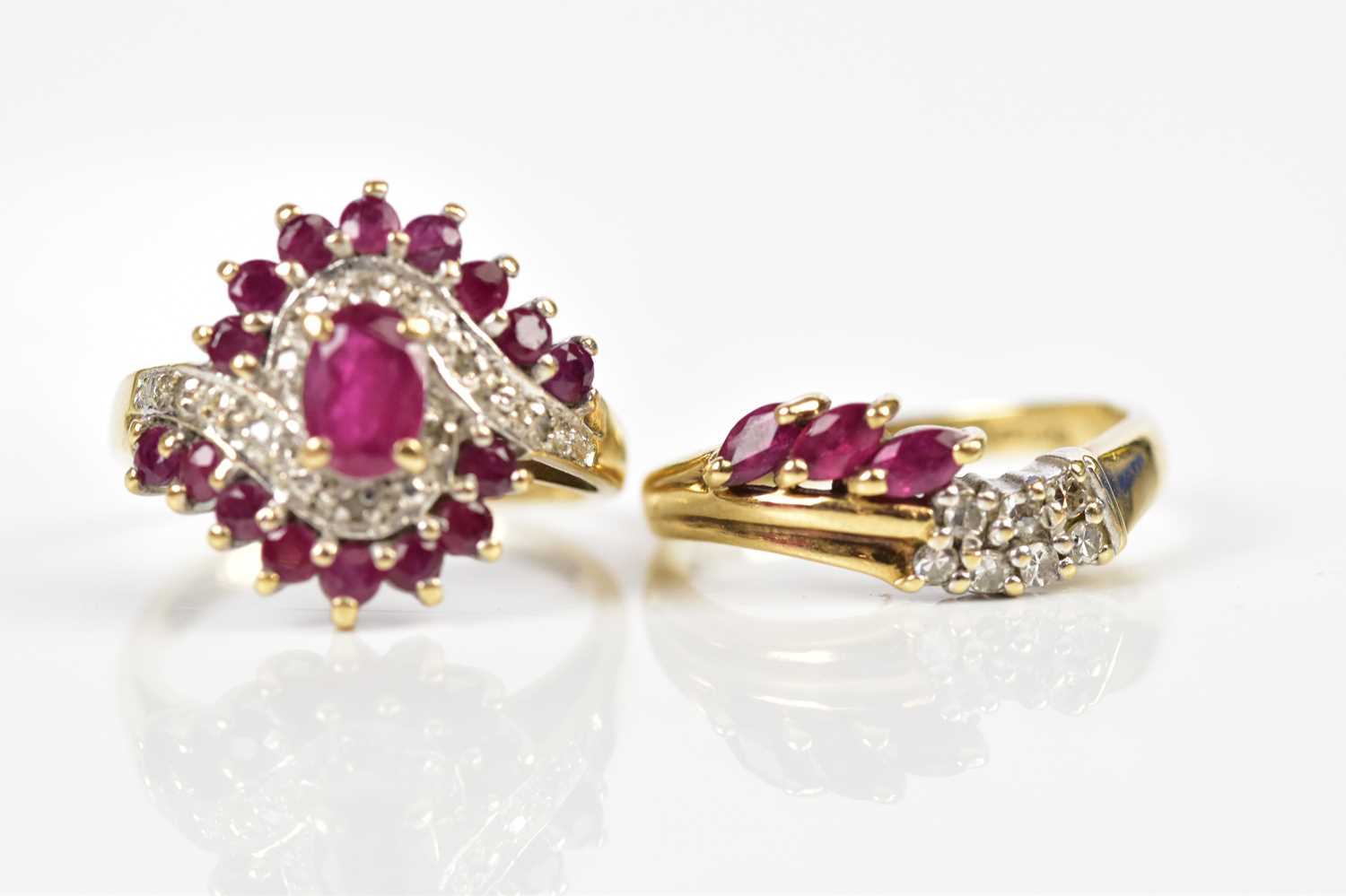 Two 9ct yellow gold simulated ruby dress rings, size K and H, approx combined weight 5.5g.