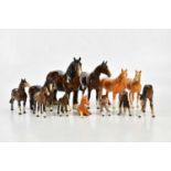 BESWICK; a collection of twelve horse figures, to include three palomino examples.