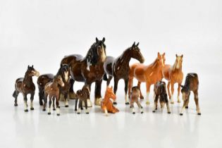 BESWICK; a collection of twelve horse figures, to include three palomino examples.