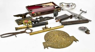 A small collection of metalware to include a trouble detector, a figure of a plane, an electroplated