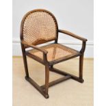 A mid 20th century child's cane seated elbow chair , height 67cm.