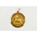 A yellow metal pendant, embossed with a ram, stamped 750, approximate weight 9.68g.