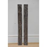 Two carved Adam and Eve oak panels, 100cm.