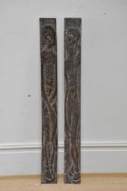 Two carved Adam and Eve oak panels, 100cm.