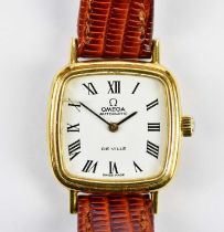 OMEGA; an 18ct yellow gold lady's DeVille wristwatch with leather bracelet and Omega buckle, no